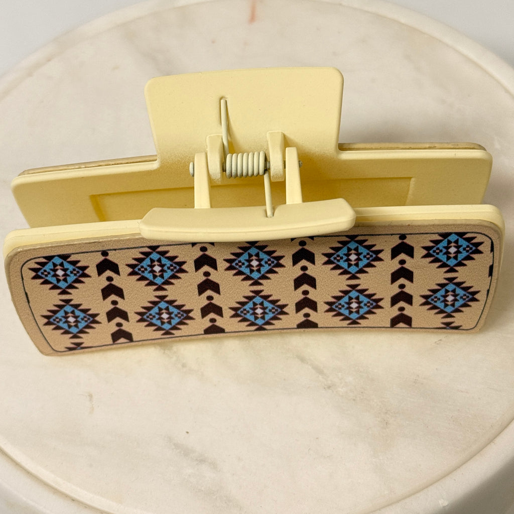 Side view of beige geometric hair claw clip