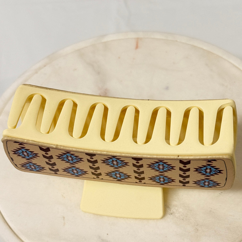 Large beige hair claw with non-slip teeth