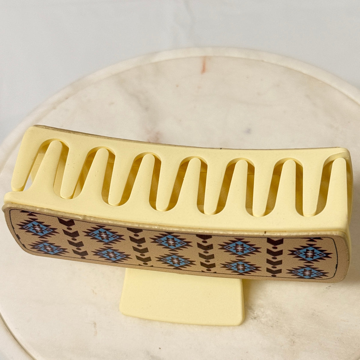 Large beige hair claw with non-slip teeth