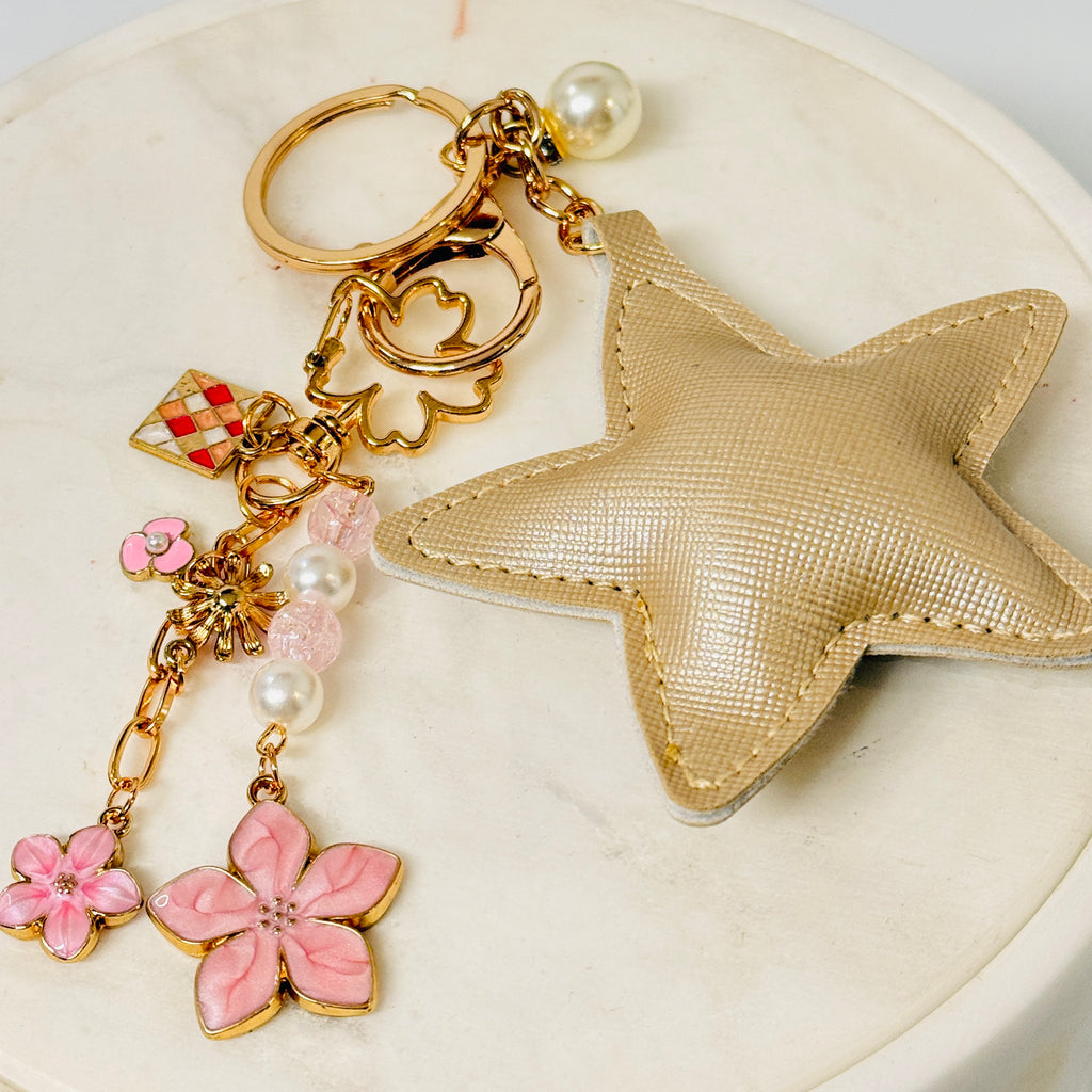 Attached khaki PU-leather star and cherry blossom bag charm