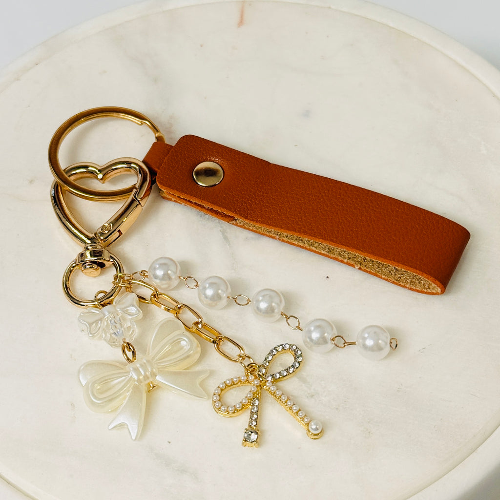 Heart bow pearl keychain with brown PU-leather strap