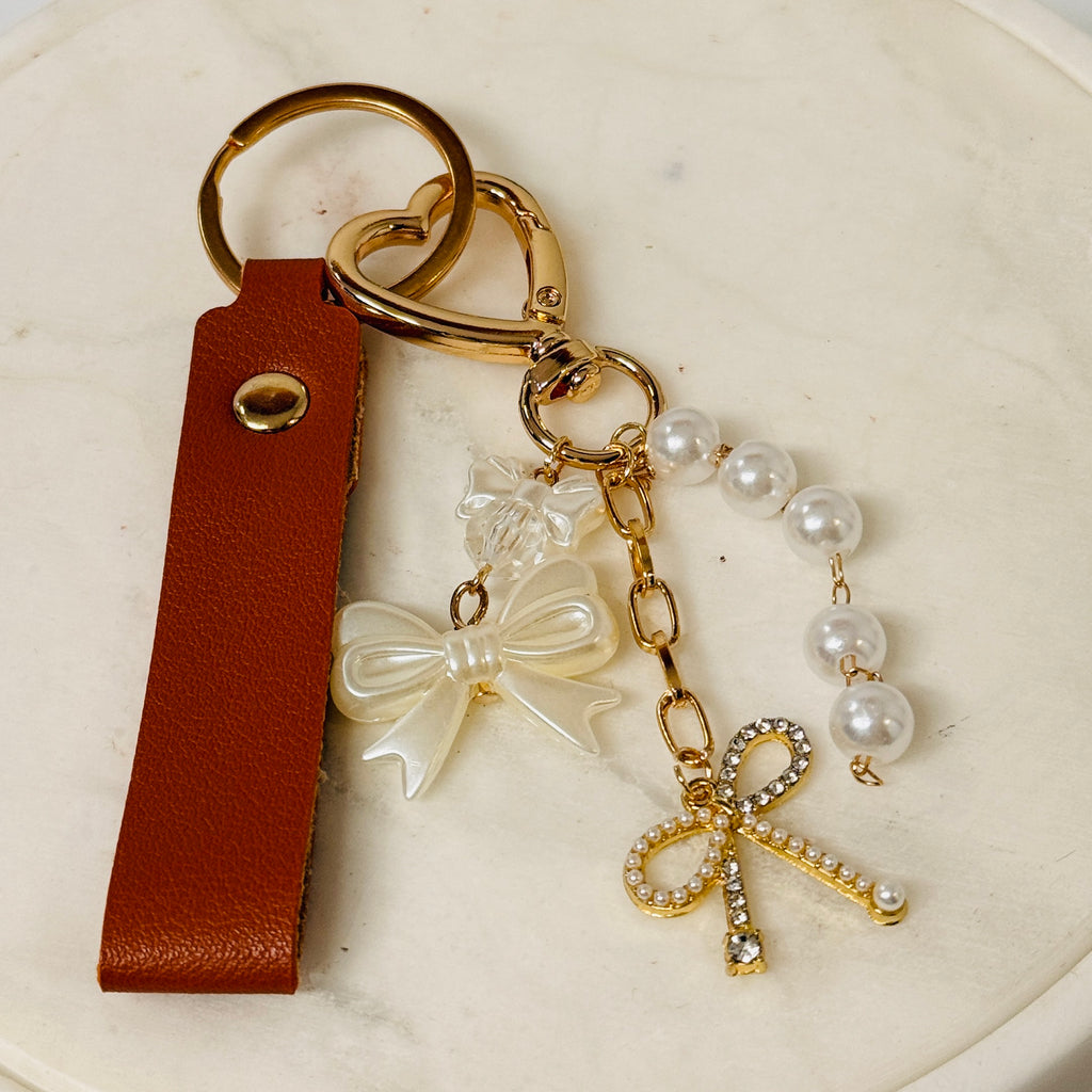 Brown textured leather keychain strap with gold-tone ring