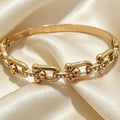 Bracelet jonc en acier inoxydable PVD or 18 carats et pierres